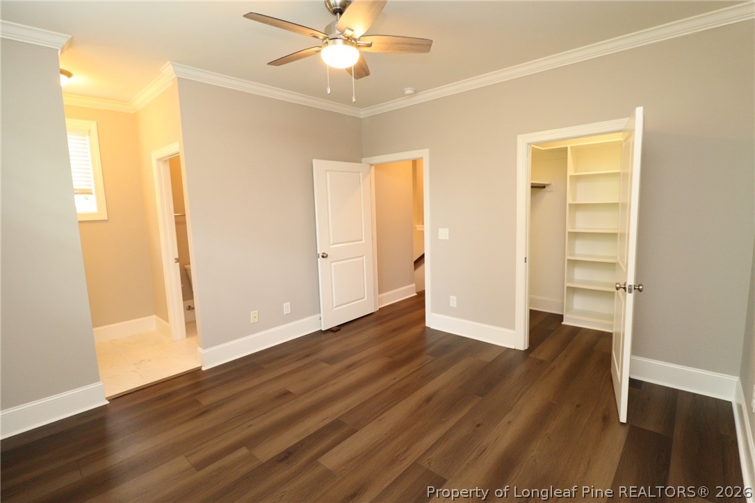 2824 Plumfield Place Raleigh, NC 27607 - Photo 23 of 33 a view of an empty room with wooden floor