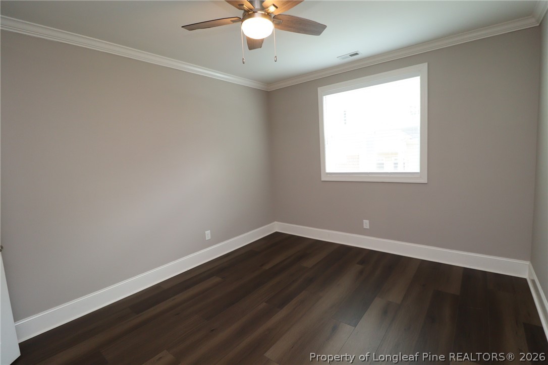 2824 Plumfield Place Raleigh, NC 27607 - Photo 29 of 33 an empty room with wooden floor and windows