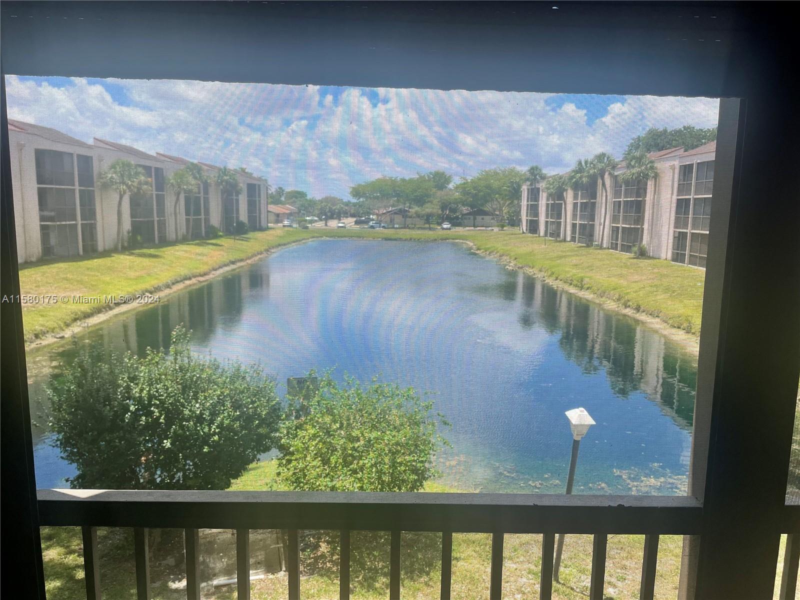 3252 Foxcroft Road, Unit 208 Miramar, FL 33025 - Photo 13 of 13 a view of swimming pool from a balcony
