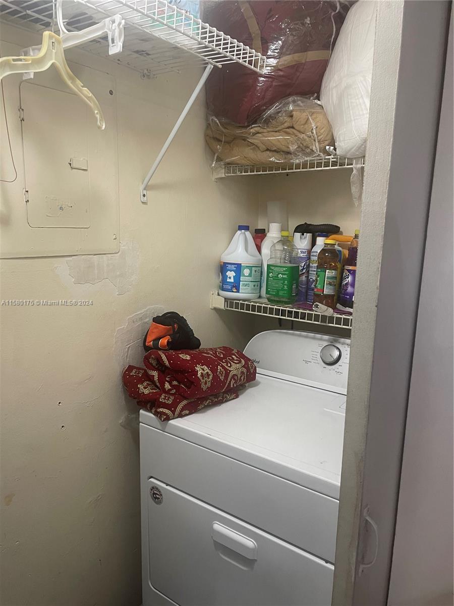 3252 Foxcroft Road, Unit 208 Miramar, FL 33025 - Photo 8 of 13 a utility room with dryer and washer