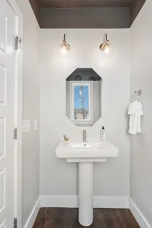 a bathroom with a sink and a mirror
