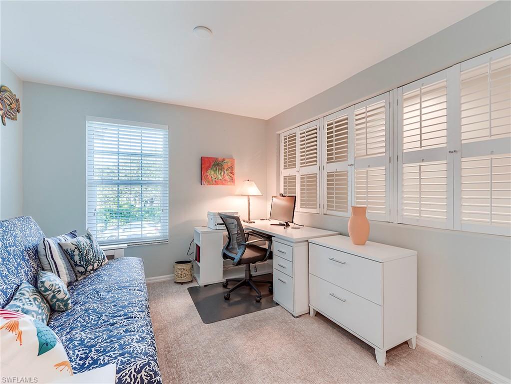 9010 Spring Run Boulevard, Unit 702 Estero, FL 34135 - Photo 13 of 35 a view of a livingroom with workspace and a window