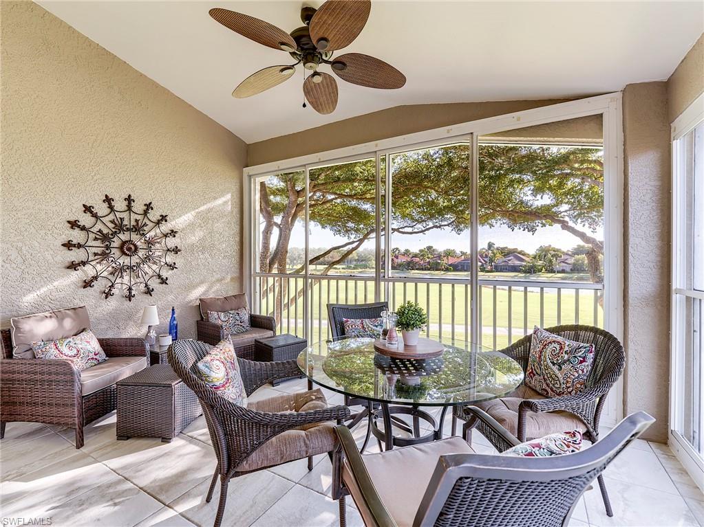 9010 Spring Run Boulevard, Unit 702 Estero, FL 34135 - Photo 22 of 35 a living room with furniture and a large window