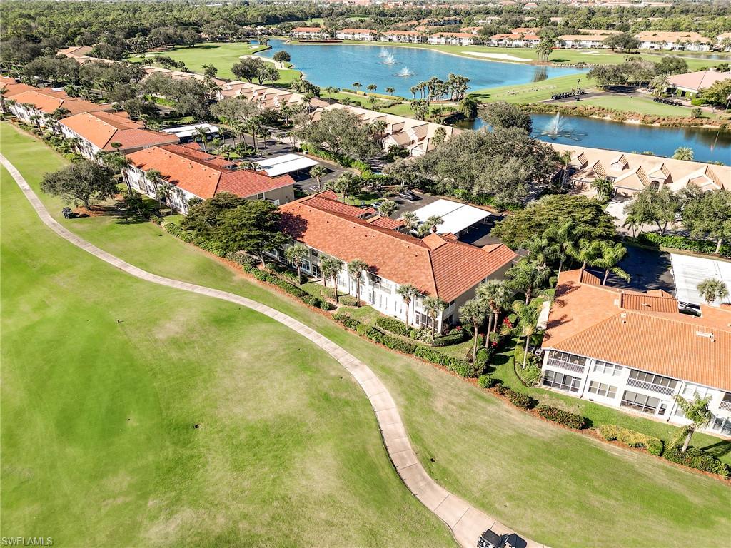 9010 Spring Run Boulevard, Unit 702 Estero, FL 34135 - Photo 23 of 35 an aerial view of residential houses with outdoor space