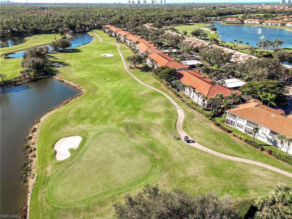 9010 Spring Run Boulevard, Unit 702 Estero, FL 34135 - Photo 24 of 35 an aerial view of residential houses with outdoor space and swimming pool