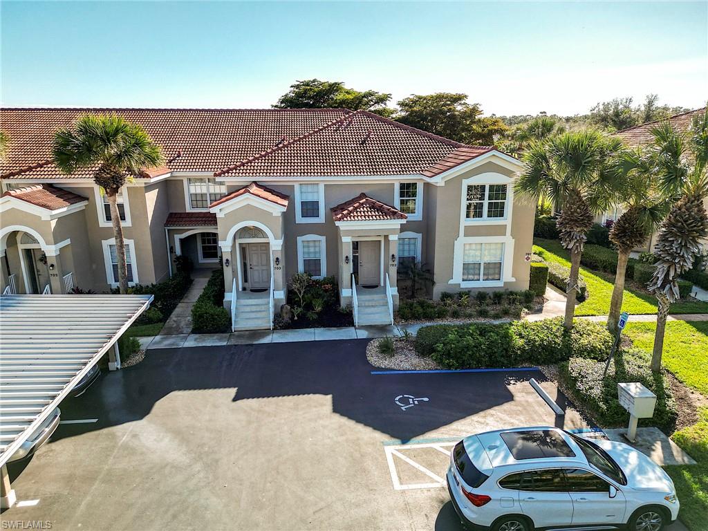 9010 Spring Run Boulevard, Unit 702 Estero, FL 34135 - Photo 25 of 35 a house view with a outdoor space