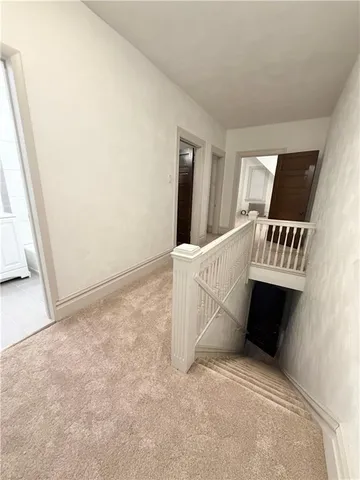 a view of a room with a window and stairs