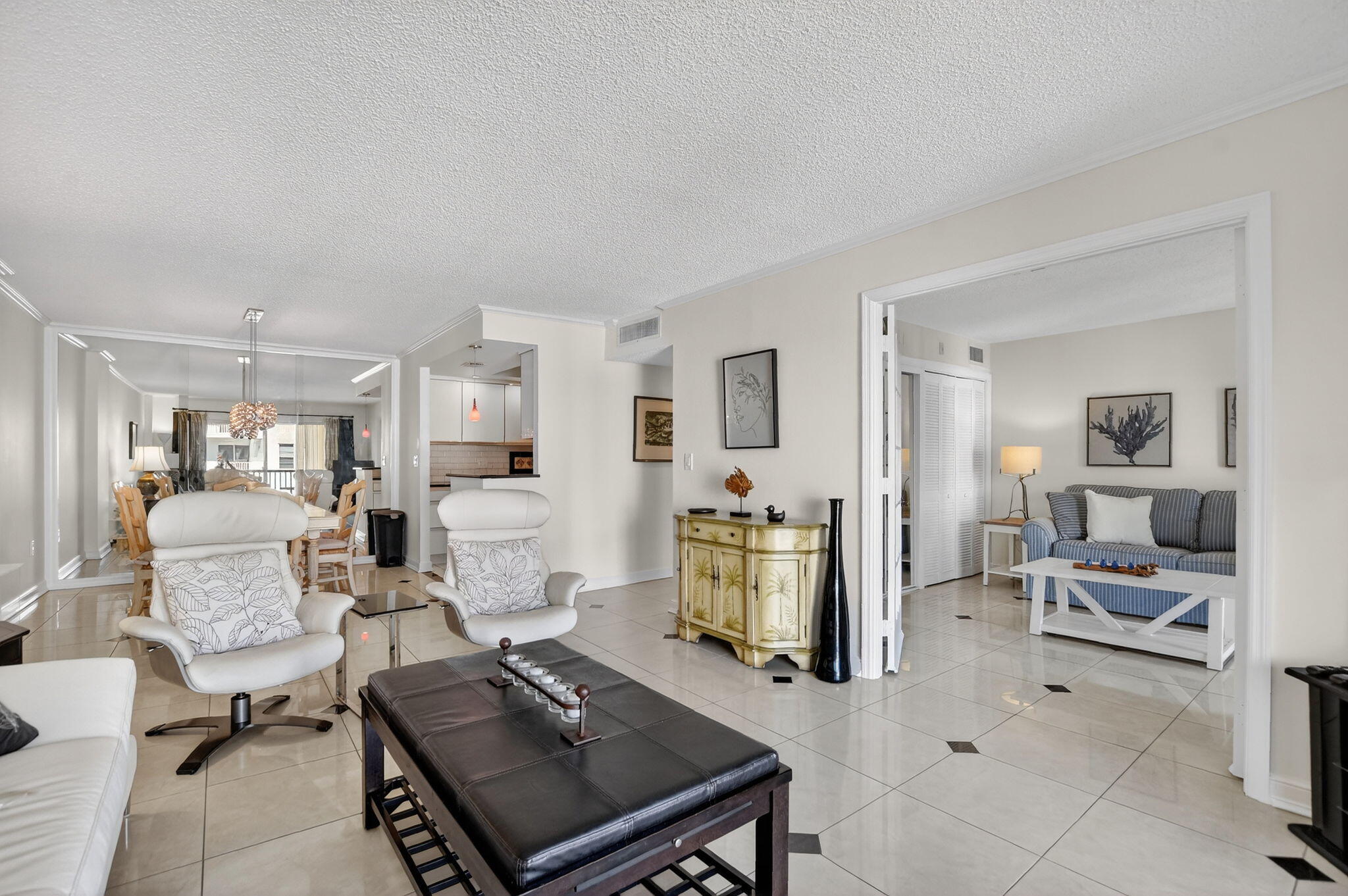 951 De Soto Road, Unit 427 Boca Raton, FL 33432 - Photo 12 of 50 a living room with furniture and a table