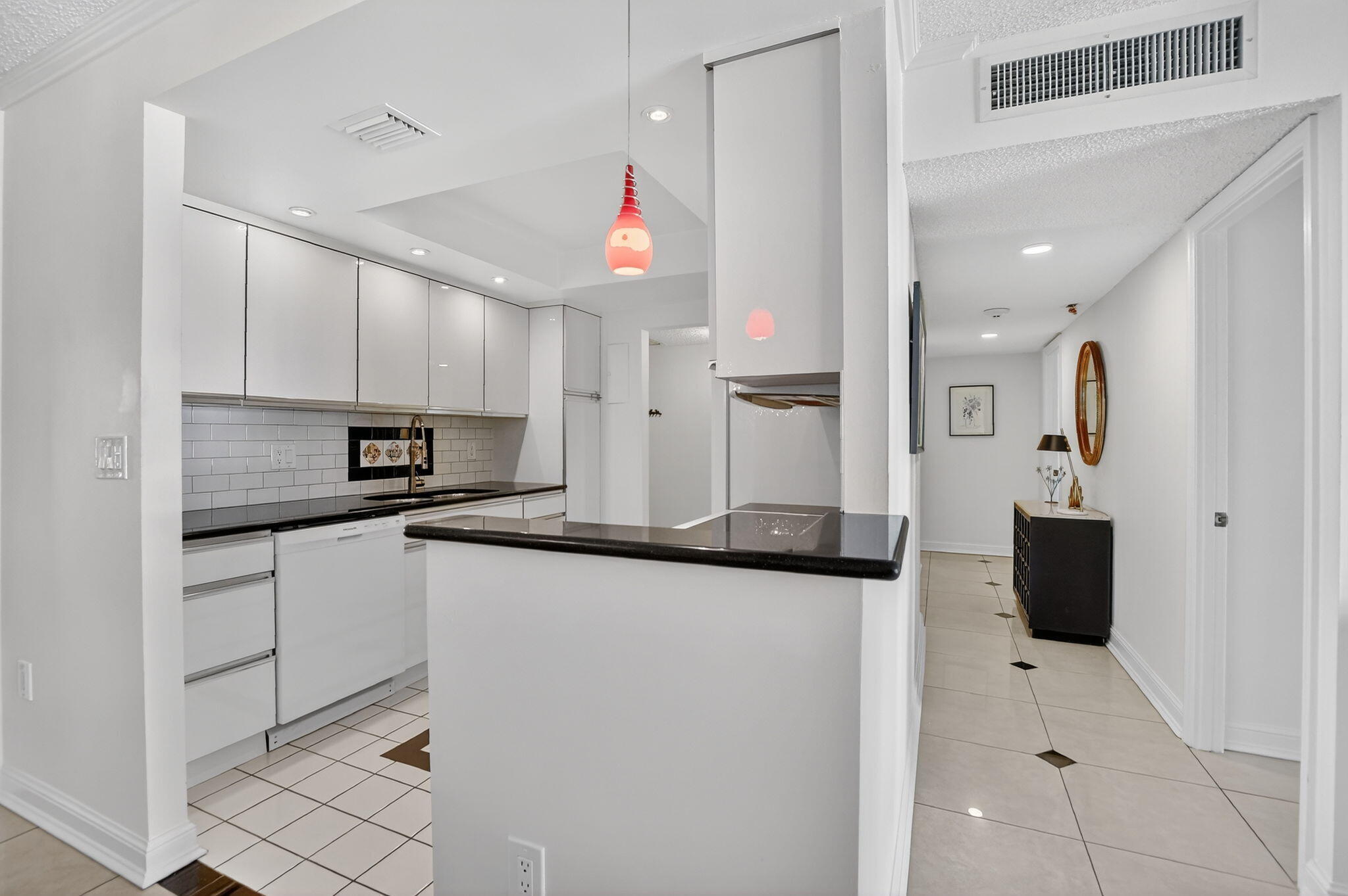 951 De Soto Road, Unit 427 Boca Raton, FL 33432 - Photo 15 of 50 a kitchen with stainless steel appliances granite countertop a sink and cabinets