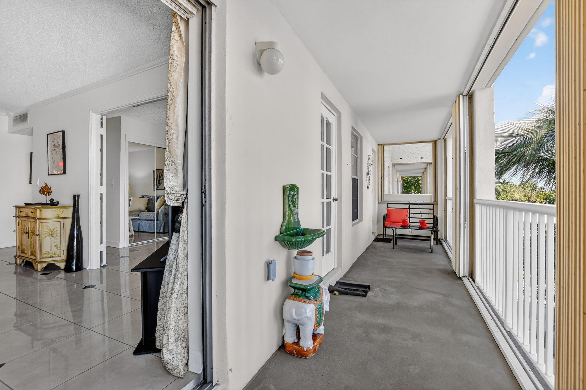951 De Soto Road, Unit 427 Boca Raton, FL 33432 - Photo 35 of 50 a view of hallway with livingroom and furniture