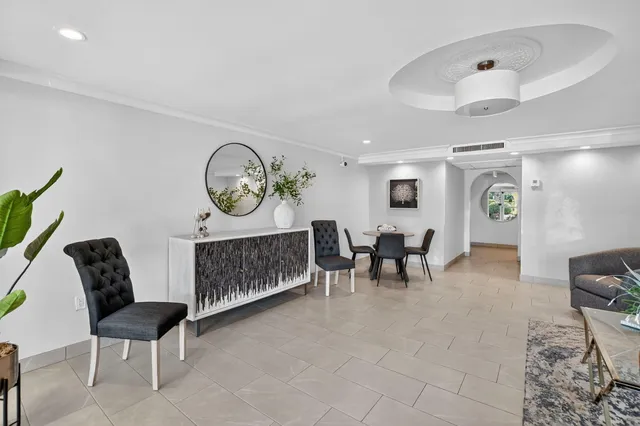 a kitchen with stainless steel appliances a stove a refrigerator and cabinets