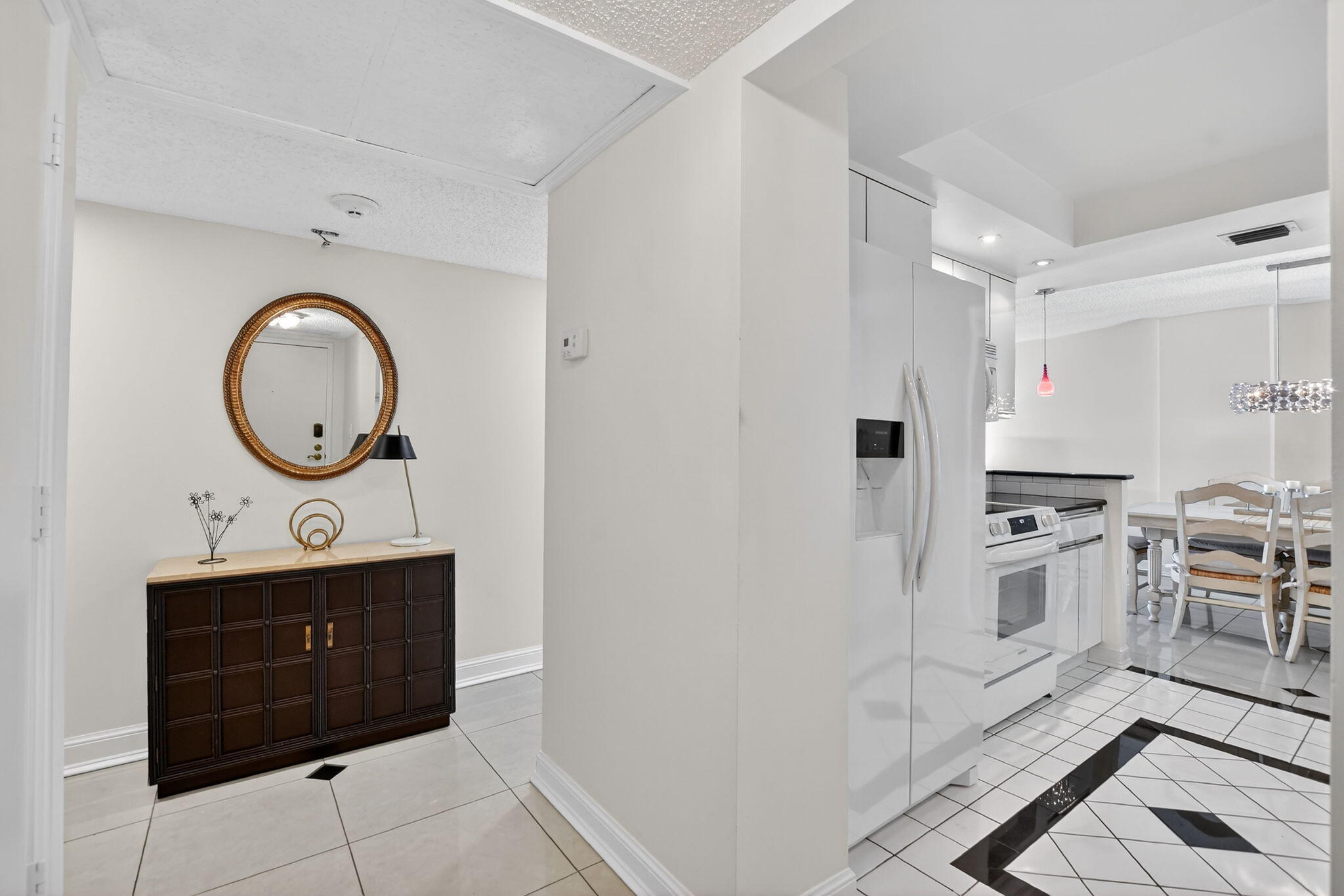 951 De Soto Road, Unit 427 Boca Raton, FL 33432 - Photo 7 of 50 a kitchen with stainless steel appliances granite countertop a refrigerator a stove and a sink