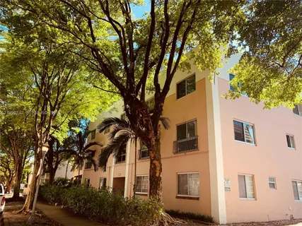 a view of a house with a tree