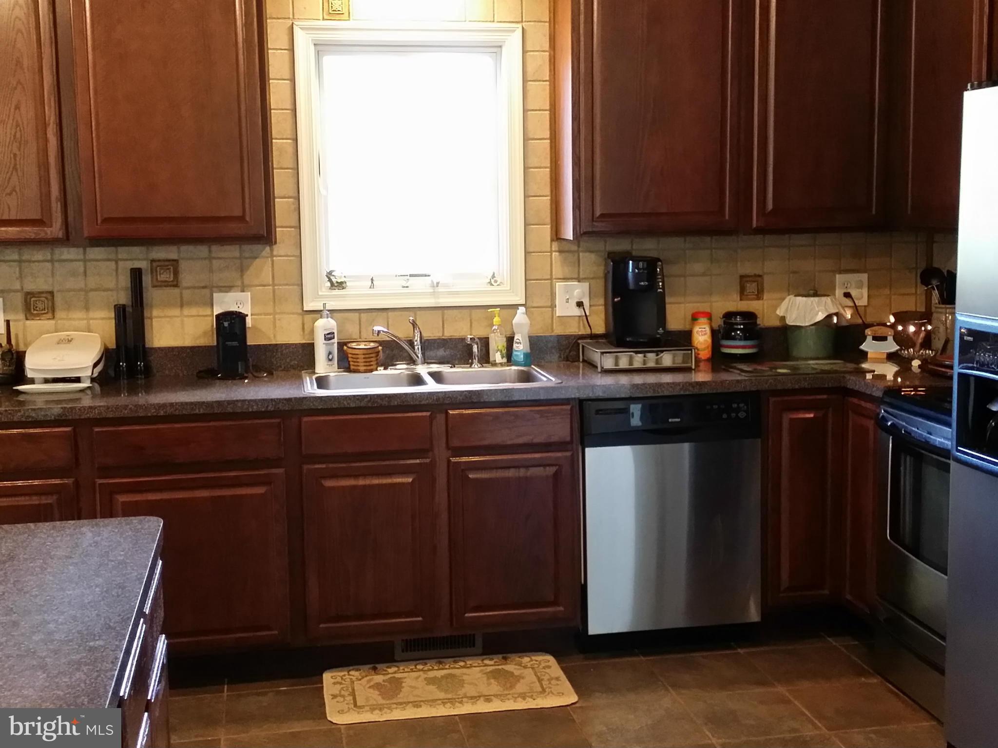 803 Turkey Ridge Road Castleton, VA 22716 - Photo 3 of 14 a kitchen with a sink stove and cabinets