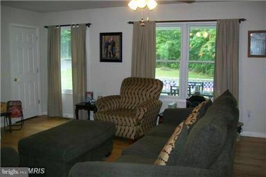 803 Turkey Ridge Road Castleton, VA 22716 - Photo 6 of 14 a living room with furniture and a window