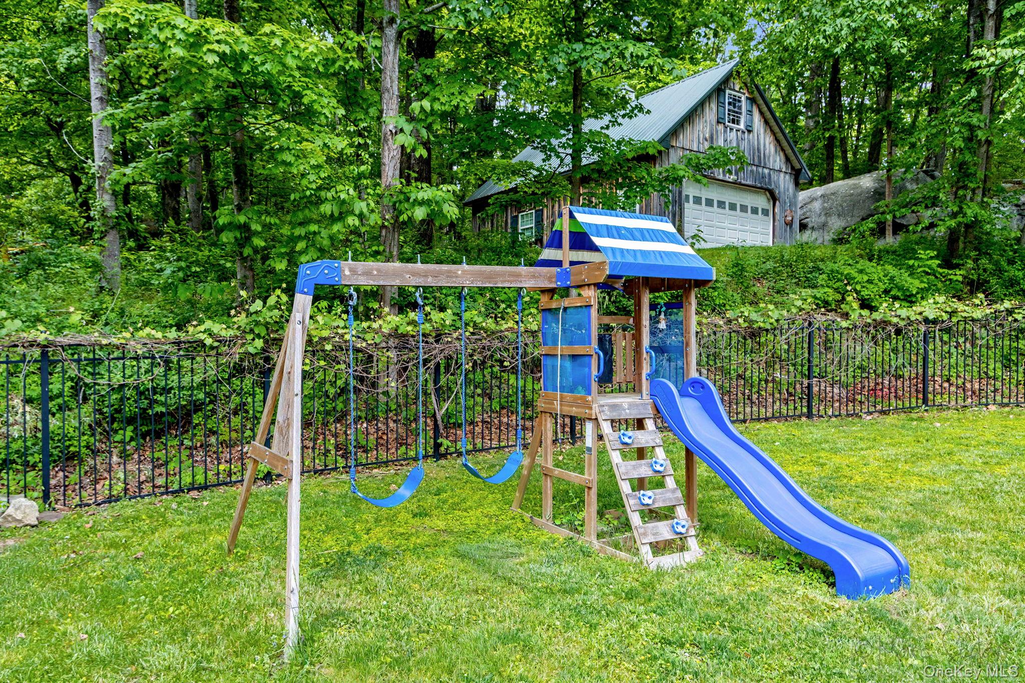 168 Old Rte 55 Pawling, NY 12564 - Photo 33 of 43 a view of a backyard with a slide and a child swing