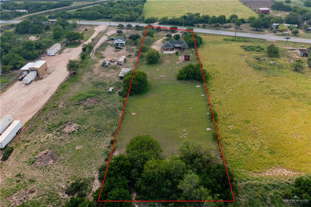20724 North Fm 493 Road Edcouch, TX 78538 - Photo 20 of 20 a view of a lake with huge green field and large trees