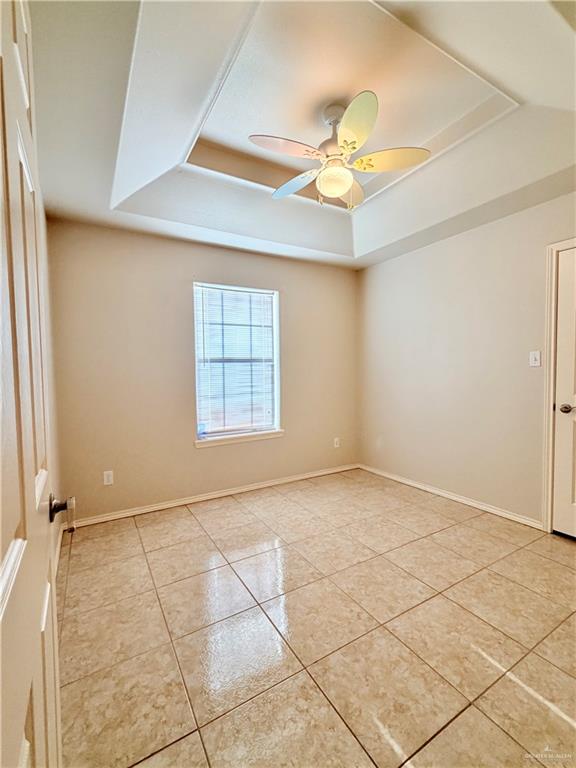 20724 North Fm 493 Road Edcouch, TX 78538 - Photo 10 of 20 an empty room with windows and ceiling fan