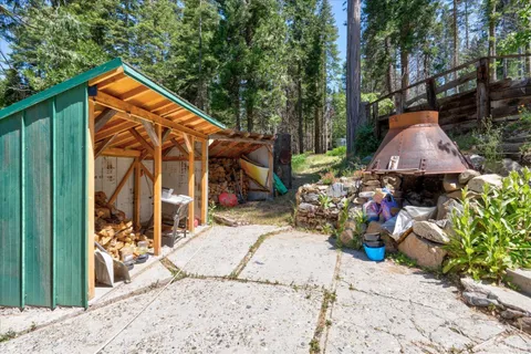 a view of a backyard with sitting area