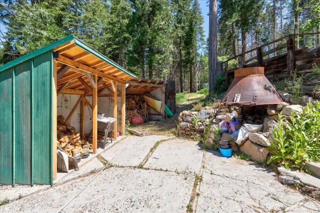 a view of a backyard with sitting area