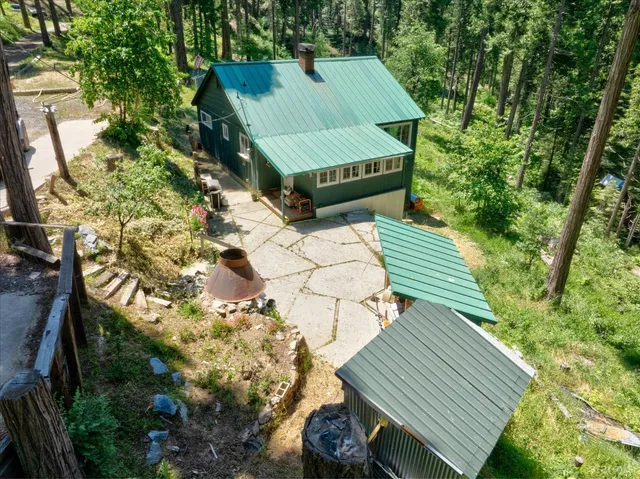 a view of a backyard with sitting area