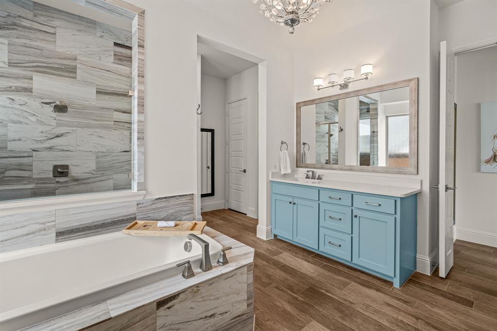 1616 Prairie Ridge Road Fort Worth, TX 76008 - Photo 21 of 39 a spacious bathroom with a tub sink and mirror