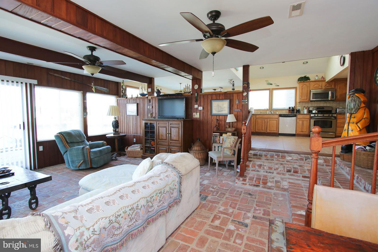 45 Amherst Road Long Beach Township, NJ 08006 - Photo 13 of 35 family room opens to outside dining & fire pit
