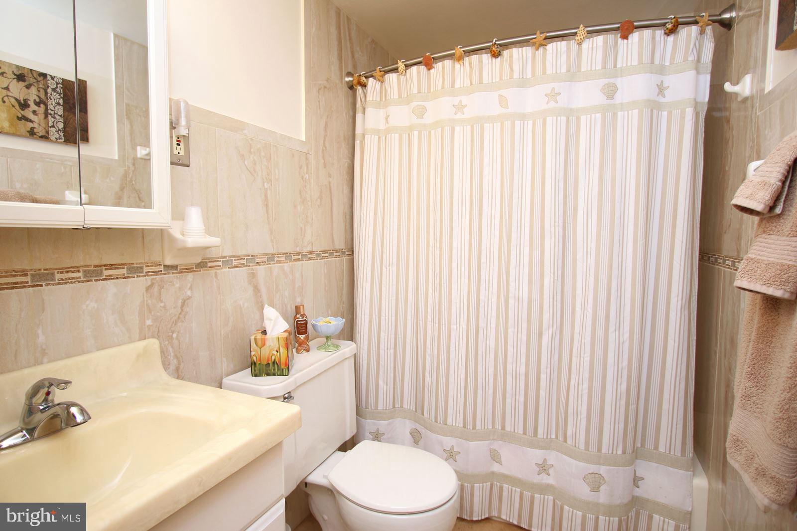45 Amherst Road Long Beach Township, NJ 08006 - Photo 18 of 35 tiled hall bath with tub/shower