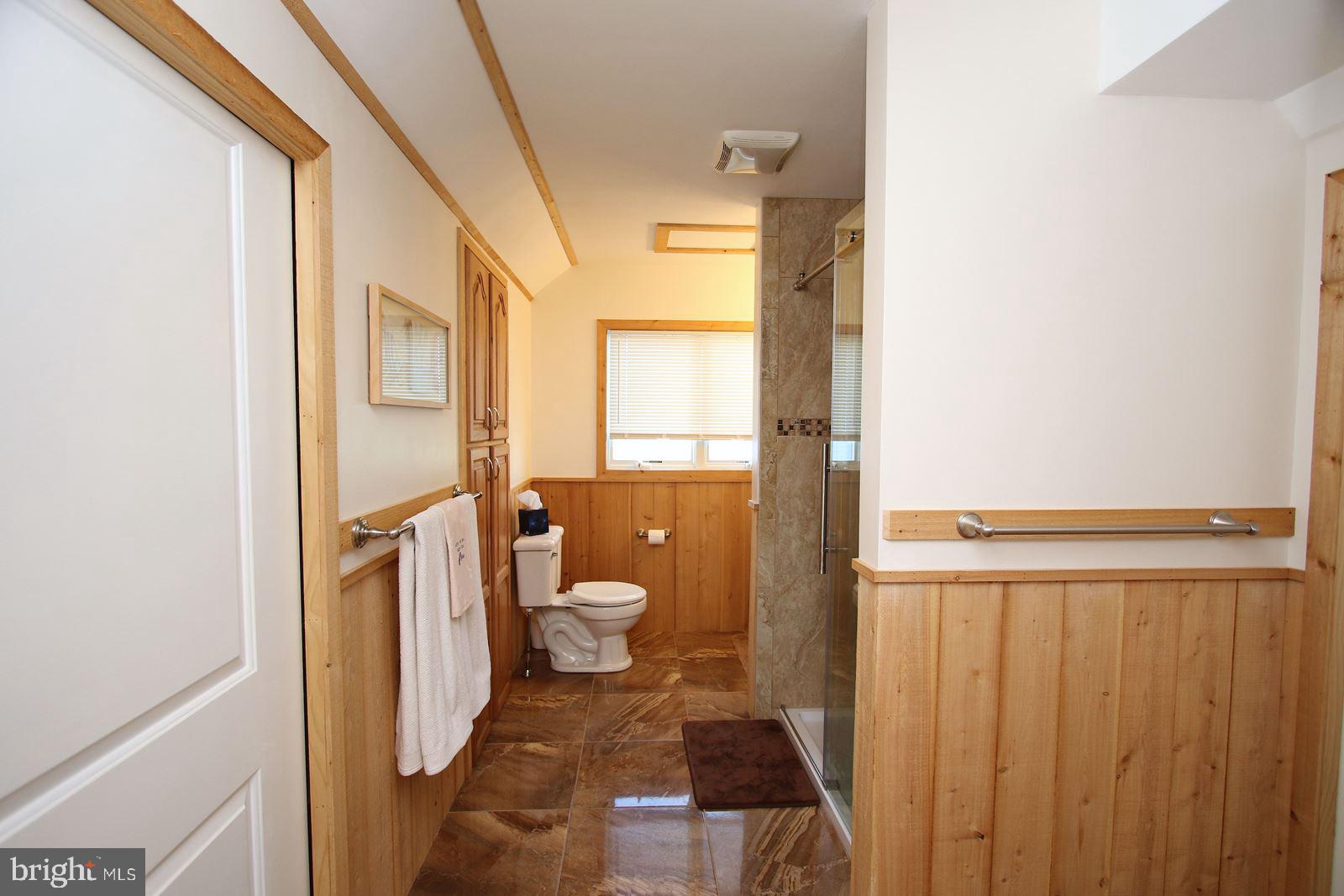 45 Amherst Road Long Beach Township, NJ 08006 - Photo 23 of 35 bath w/shower & attic storage behind pocket doors