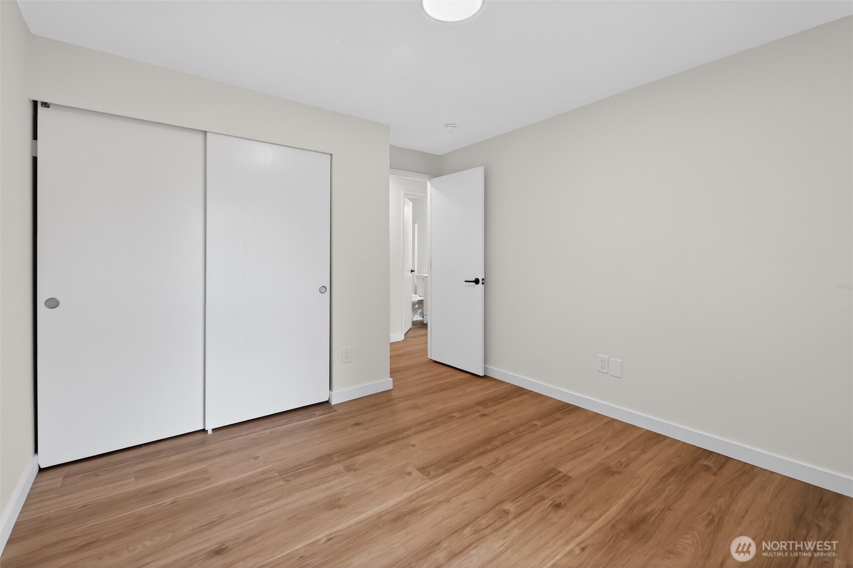 320 213th Place Southwest Bothell, WA 98021 - Photo 21 of 29 a view of an empty room with wooden floor