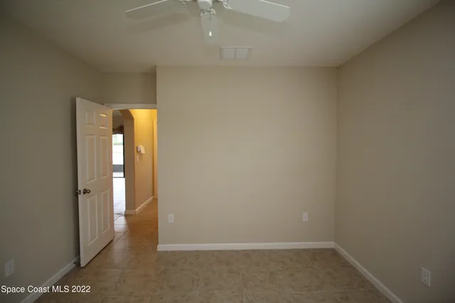 a view of room with window and cabinet