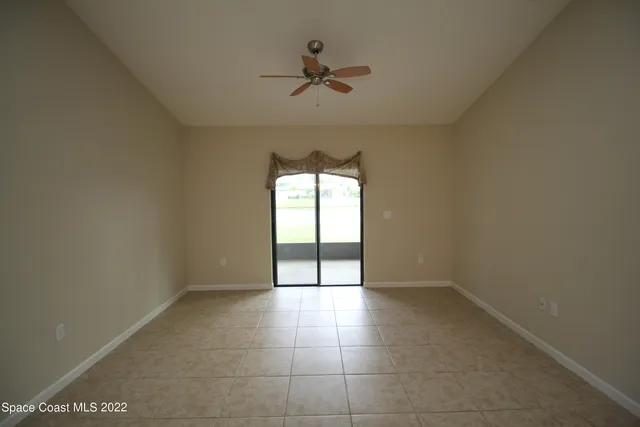 a view of an empty room and a window