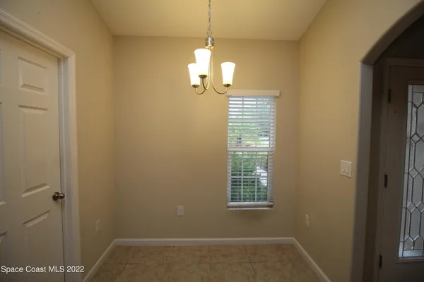 a kitchen with granite countertop a refrigerator and a sink