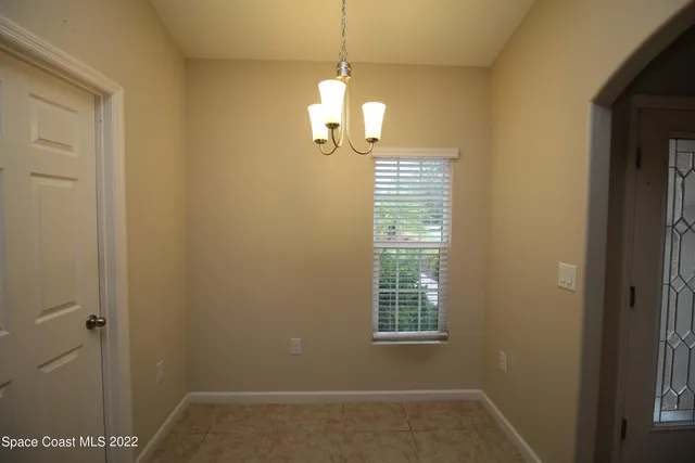 a kitchen with granite countertop a refrigerator and a sink