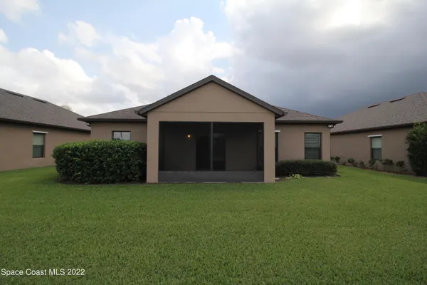 a house view with a backyard space