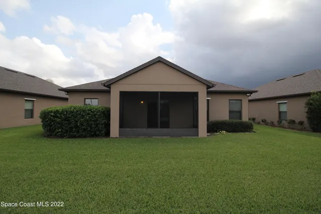 a house view with a backyard space