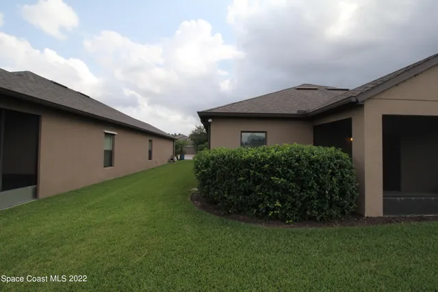 a view of a patio with swimming pool