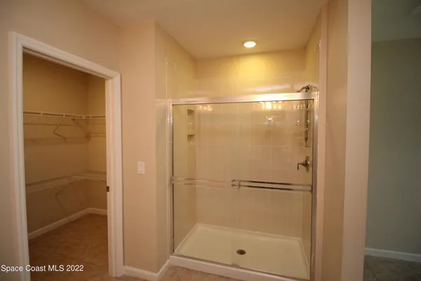 a view of a bathroom from a hallway