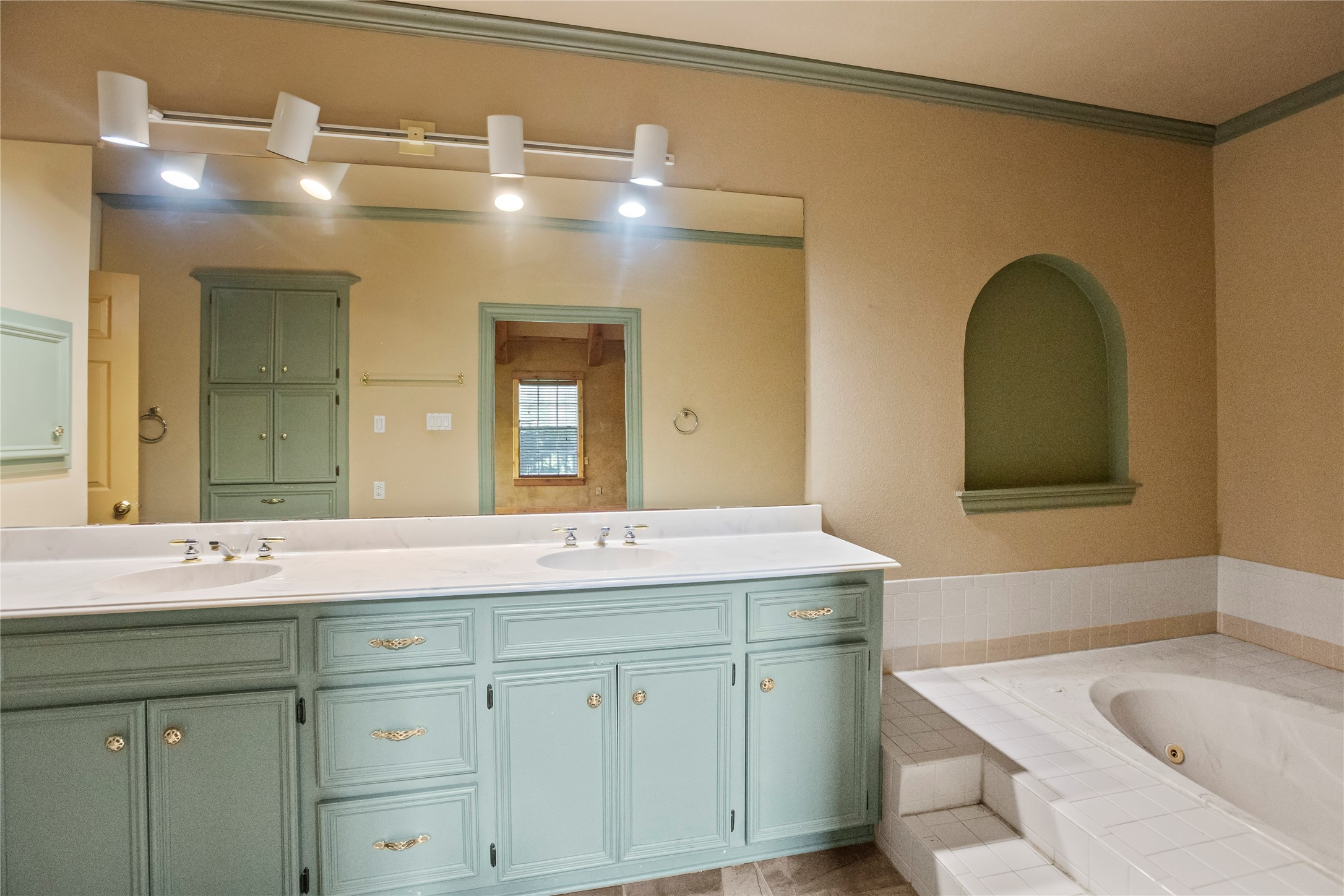 22916 East Martin Drive Porter, TX 77365 - Photo 22 of 43 a bathroom with a sink and a mirror