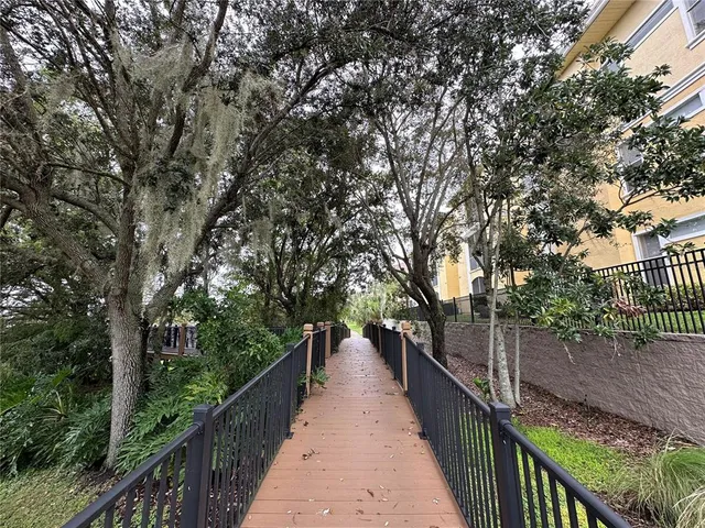 a view of a balcony with wooden fence