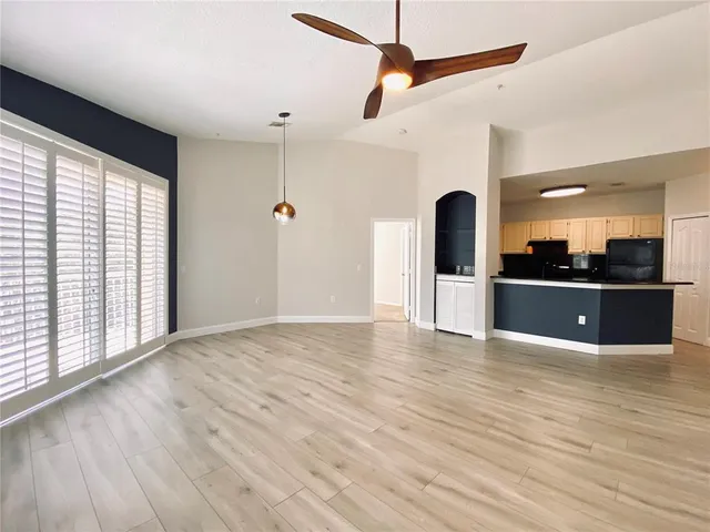 a view of a kitchen with a sink and a window