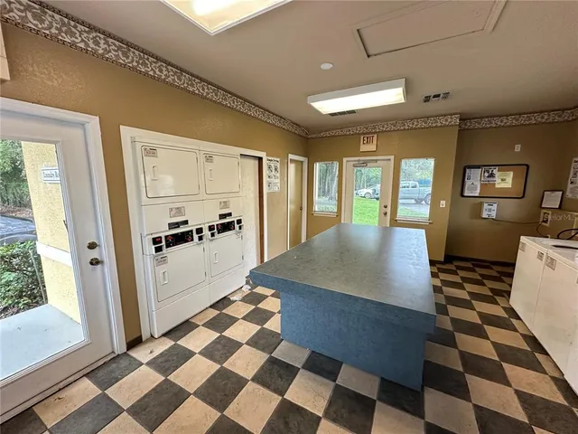a kitchen with a checkered floor and a black white checkered floor