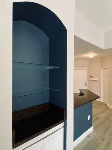 a kitchen with a refrigerator and a sink