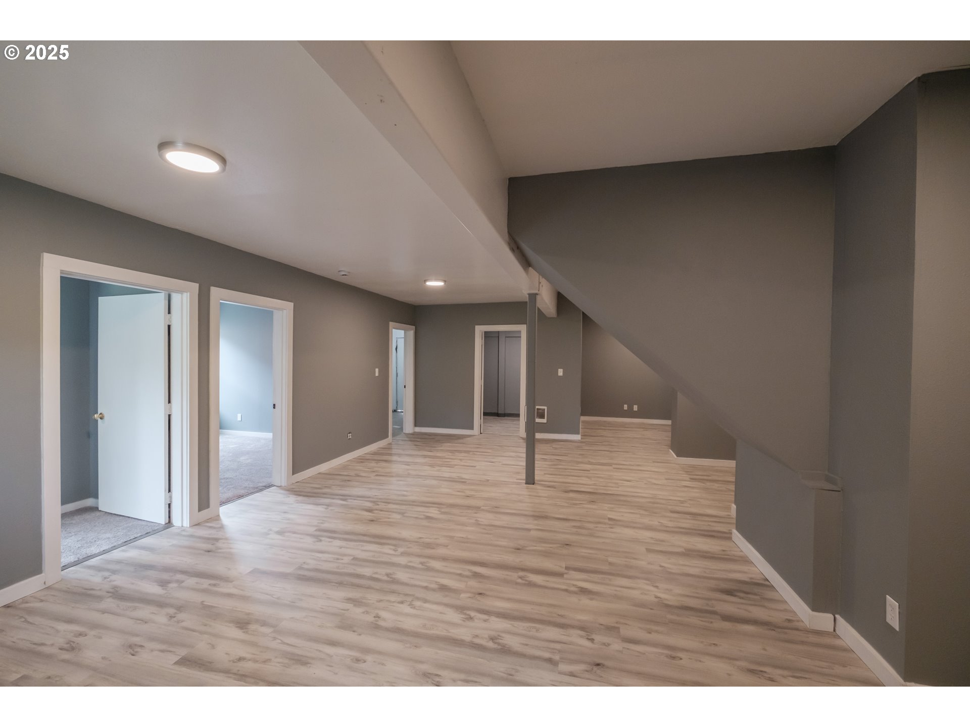 640 8th Street Astoria, OR 97103 - Photo 14 of 21 a view of an empty room with wooden floor