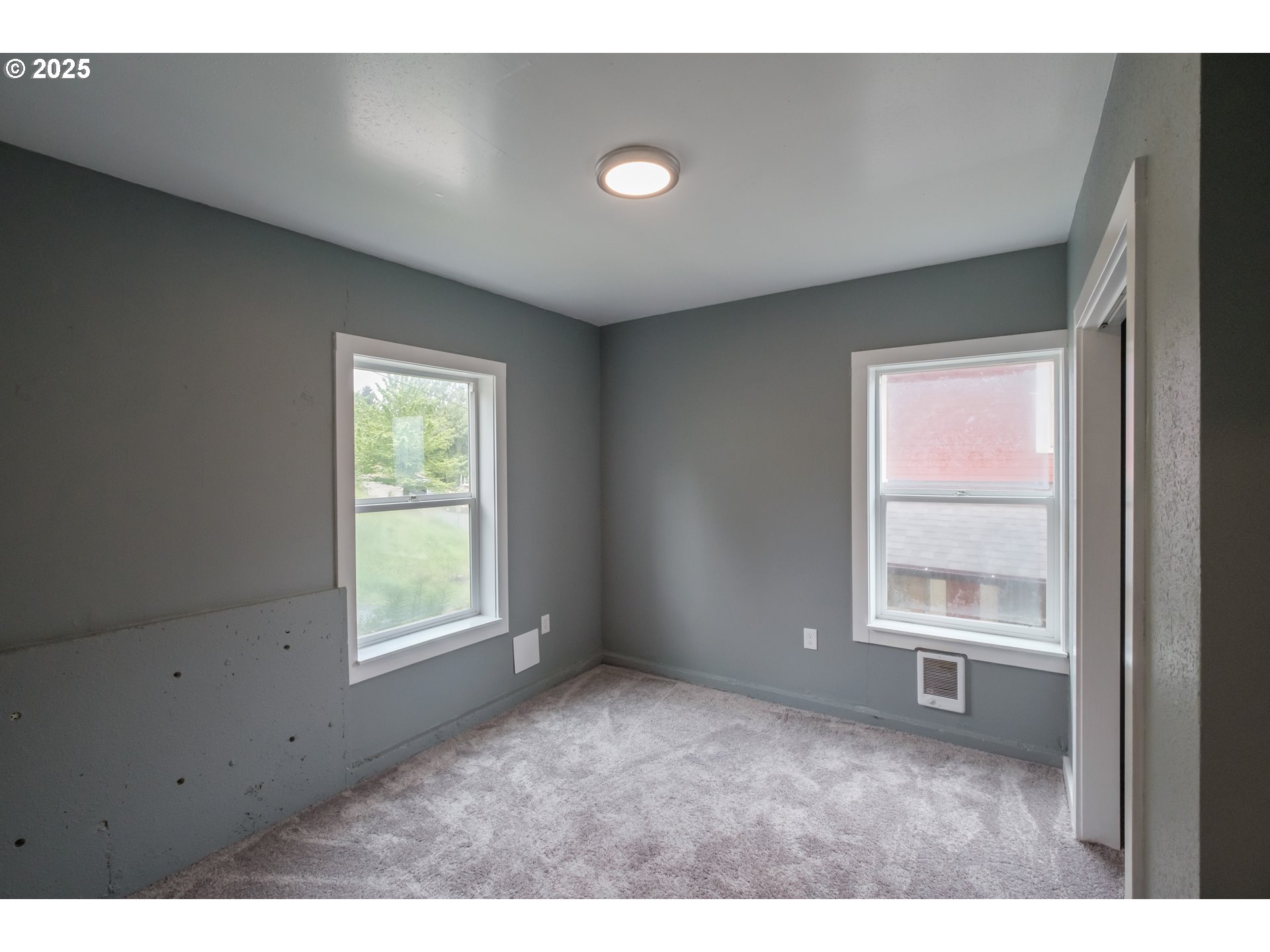 640 8th Street Astoria, OR 97103 - Photo 15 of 21 a view of an empty room with a window
