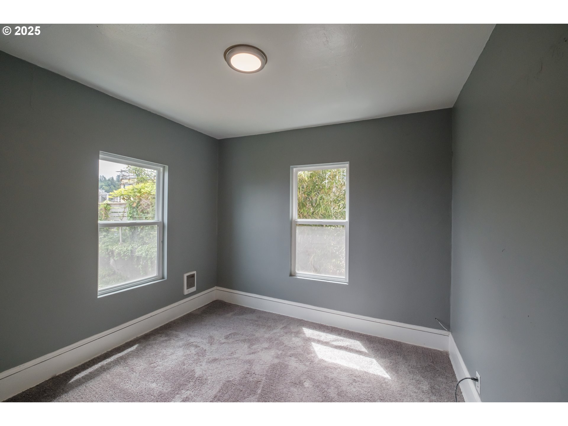 640 8th Street Astoria, OR 97103 - Photo 17 of 21 a view of an empty room with a window