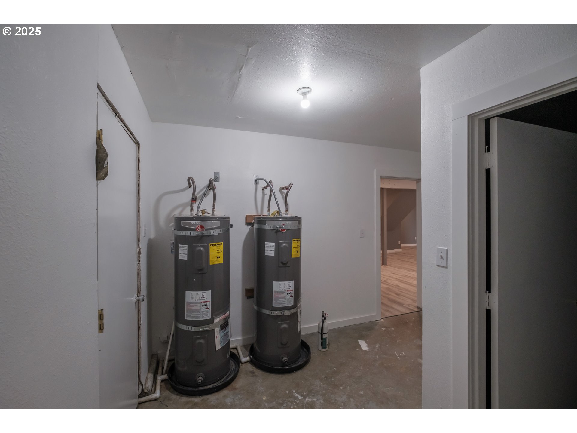 640 8th Street Astoria, OR 97103 - Photo 21 of 21 a bathroom with a refrigerator and mirror