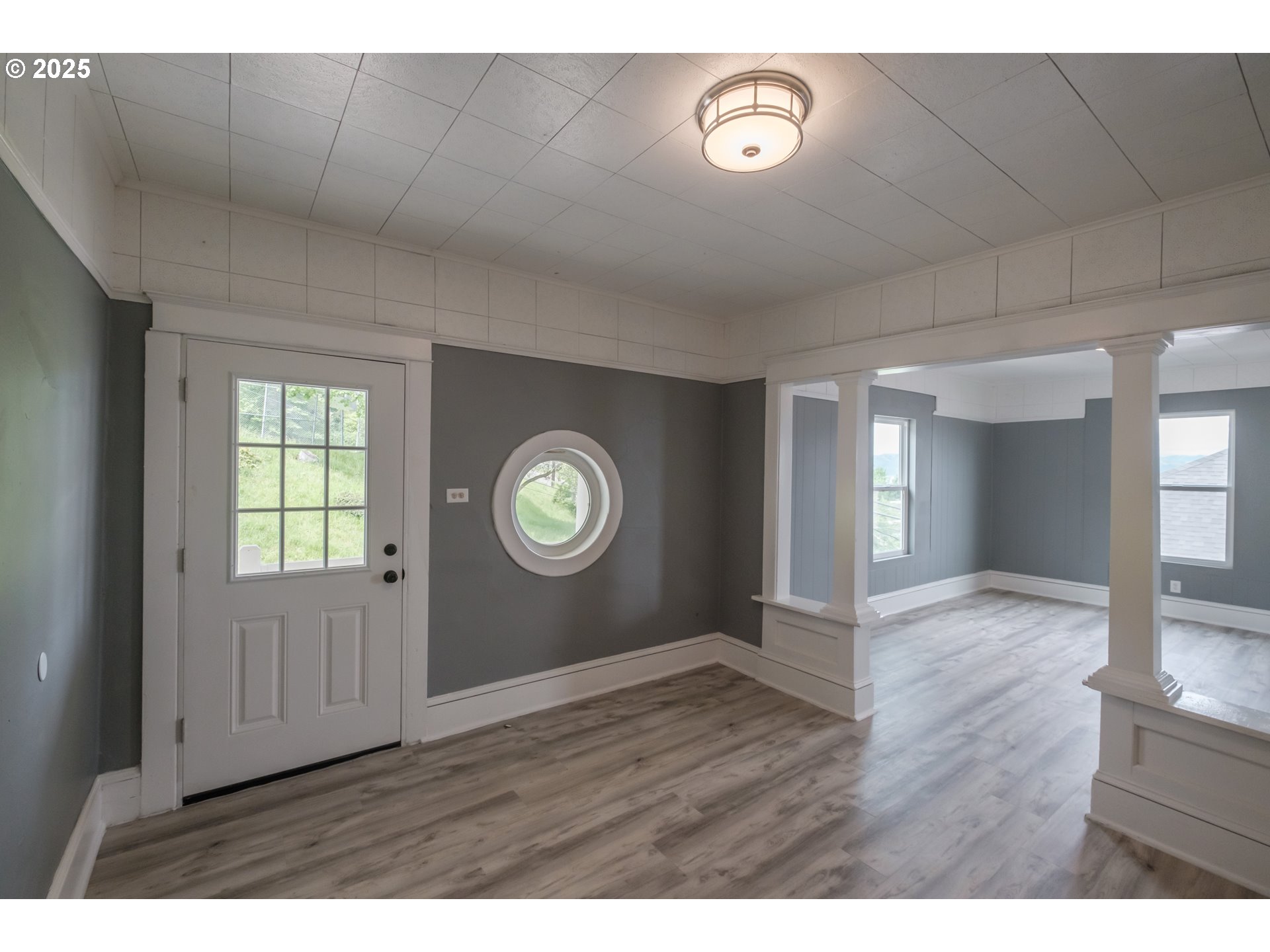 640 8th Street Astoria, OR 97103 - Photo 4 of 21 a view of an empty room with a window