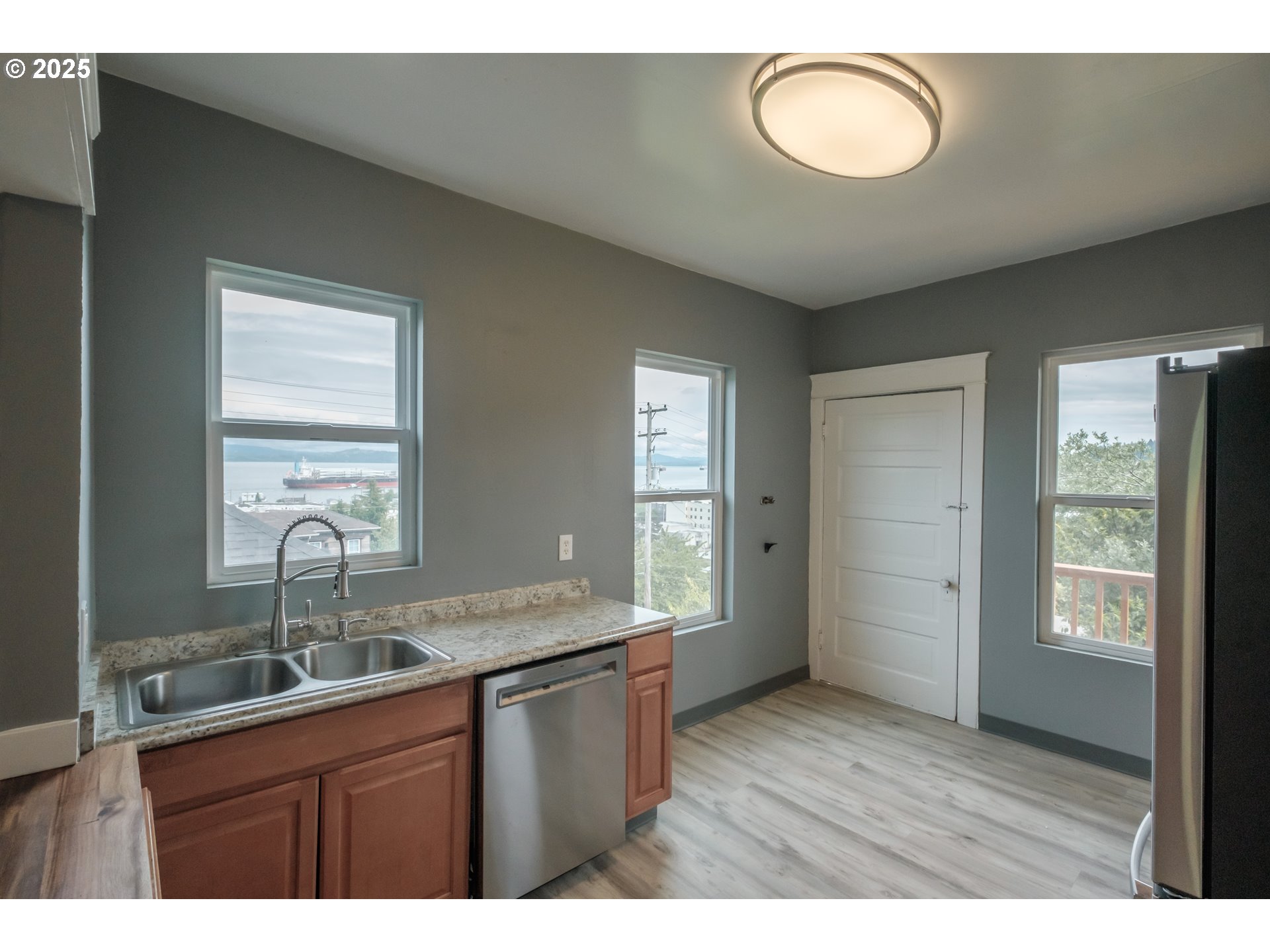 640 8th Street Astoria, OR 97103 - Photo 10 of 21 a kitchen with cabinets appliances and a window