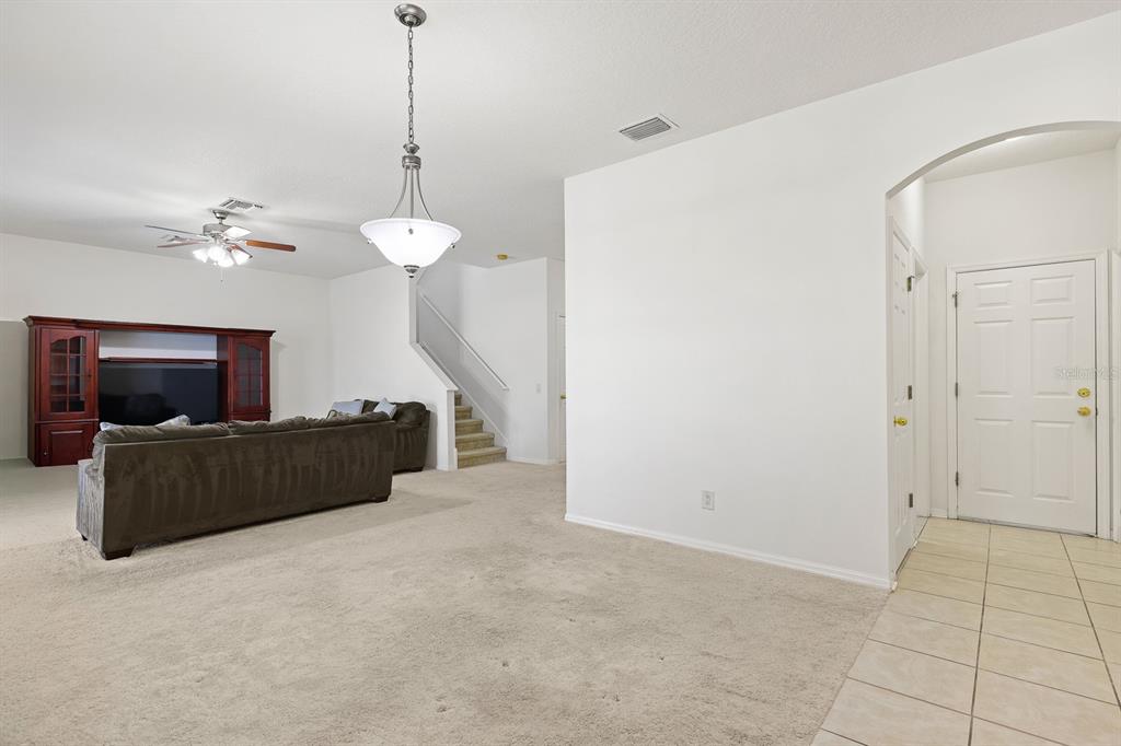 1411 Main Street Valrico, FL 33594 - Photo 17 of 44 a living room with furniture and a flat screen tv